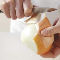 Step 2. Peel off the skin and possibly one layer of each half with a paring knife. Trim about ½ inch from the stem end of each half, but during the rest of the chopping, keep the root end on each half intact; otherwise the onion will fall apart.